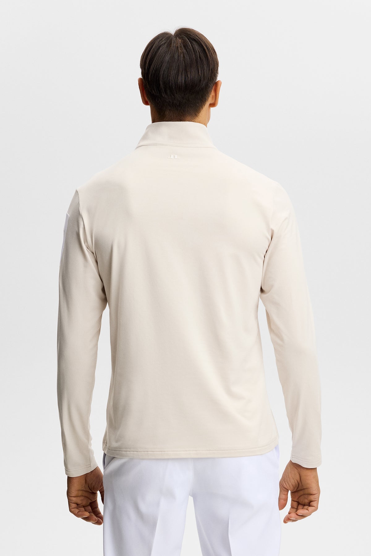J.Lindeberg Keaton Quarter Zip Mid Layer Moonbeam – detail van rubberen mouwprint en kwartritssluiting