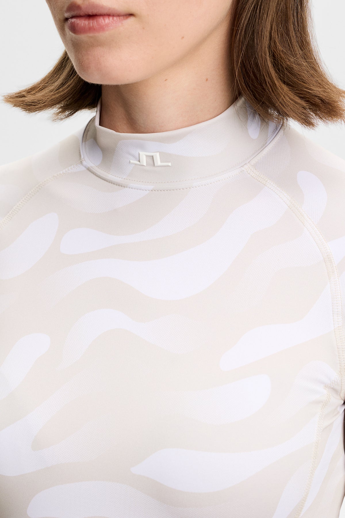 J.Lindeberg Ella Print Compression Top – UPF 40+ and moisture management