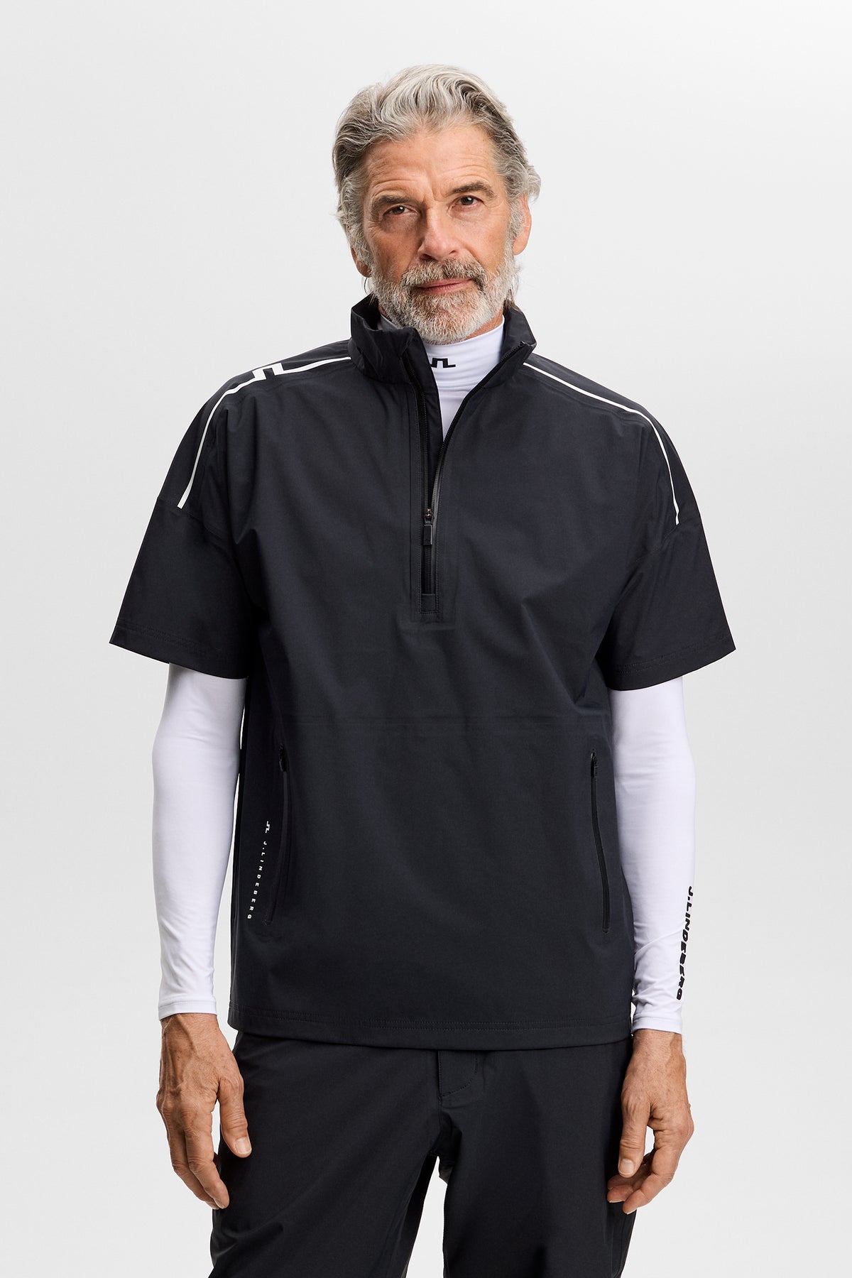 J.Lindeberg Shay Rain Shirt Zwart – achteraanzicht met JL Bridge streep op de schouder